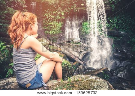 woman asia travelers travel. Walking hand travelers travel nature Forests mountains waterfalls. puhinrongkla romklao-paradorn waterfall