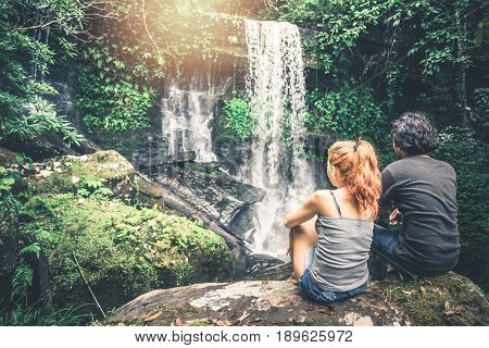 Male and woman couples asia. Walking hand travelers travel nature Forests mountains waterfalls. puhinrongkla romklao-paradorn waterfall