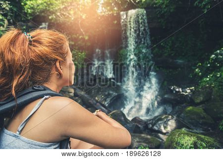 woman asia travelers travel. Walking hand travelers travel nature Forests mountains waterfalls. puhinrongkla romklao-paradorn waterfall