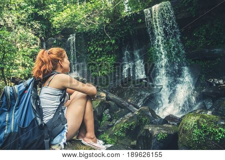 woman asia travelers travel. Walking hand travelers travel nature Forests mountains waterfalls. puhinrongkla romklao-paradorn waterfall