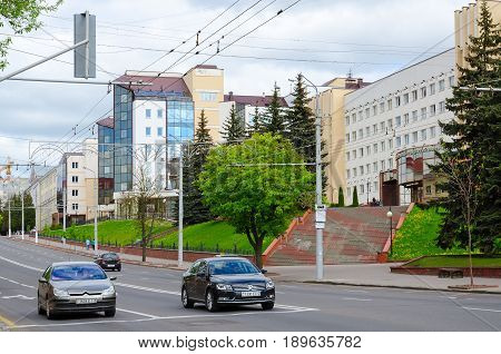 VITEBSK BELARUS - MAY 21 2017: Vitebsk State Order of Friendship of Peoples Medical University on Frunze Avenue Vitebsk Belarus. Unknown people are walking down street