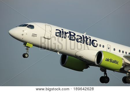 Amsterdam the Netherlands - June 2nd 2017: YL-CSB Air Baltic Bombardier BD-500 taking off from Polderbaan Runway Amsterdam Airport Schiphol