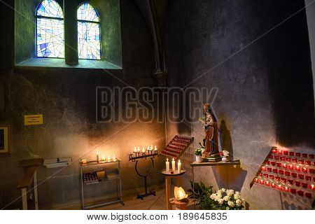 Interlaken, Switzerland - 24 September 2016: Burning church candles of Castle church at Interlaken on Switzerland
