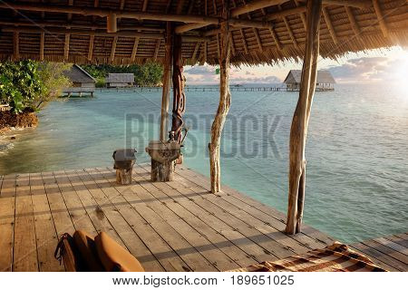 beachhouse with sundown and blue water in asia