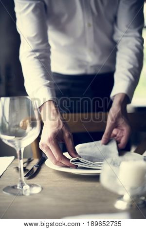Restaurant Staff Setting Table in Restaurant for Reception