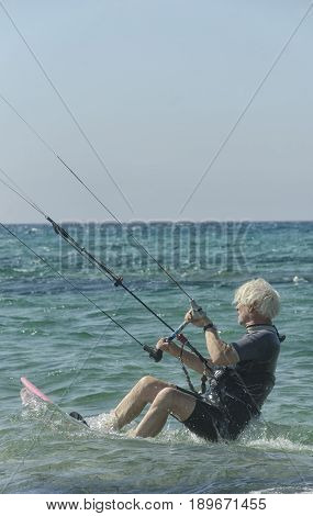 Porto Paglia Italy - October 03 2016: Greybeard keeps active by practicing extreme sport
