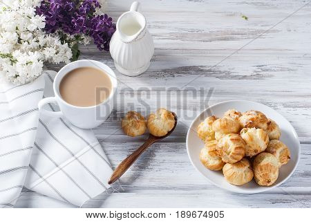 Coffee And Eclairs On A White Background