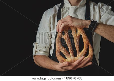 Hands men holding fougas bread