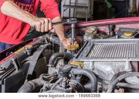 Mechanic Working On A Car Engine
