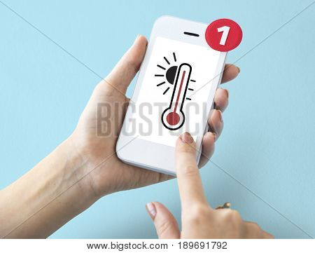 Hands working on digital device network graphic overlay