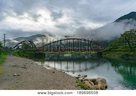 Japanese Countryside Landscape With Two Bridges Over River