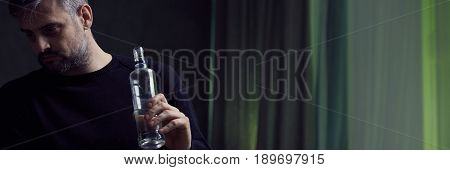 Man Holding Bottle Of Alcohol