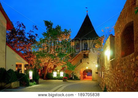 Night view on castle Schloss Laufen patio, restaurant, tower. Castle on Rhainfall waterfall biggest in Europe. European castles. Swiss castle holidays vacations famous sightseeing tours