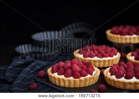 Delicious Raspberry Mini Tarts On Dark Background