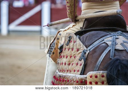 Picador bullfighter lancer whose job it is to weaken bull's neck muscles in the bullring for Jaen Spain