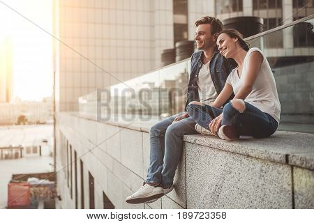 Beautiful romantic couple is having rest in the city. Enjoying the company of each other.