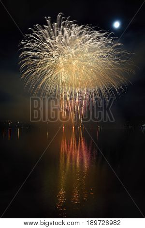 Beautiful colorful fireworks on the water surface with a clean black background. Fun festival Brno Dam - Czech Republic.