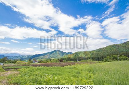 Beautiful landscape of Takayama mura at sunny summer or spring day and blue sky in Kamitakai District in northeast Nagano Prefecture Japan.