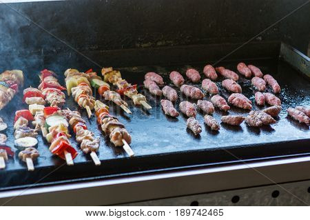 Tasty meat on a barbecue. Delicious food for family picnic.