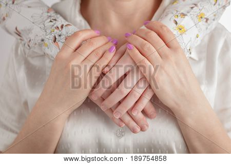 teen daughter with her mature mother hugging