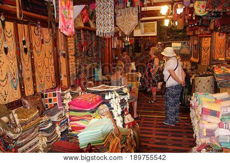 FETHIYE, TURKEY, 31ST MAY 2017:English tourists in a traditional Turkish carpet shop in fethiye, turkey, 31st may 2017