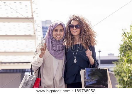 Two Beautiful Girls With Shopping Bags