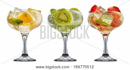 fresh fruit alcohol cocktail or mocktail in classic margaritta glass with ice, strawberry, kiwi, orange and mint isolated on white background