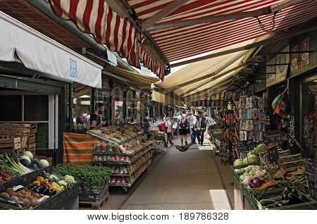 VIENNA, AUSTRIA-JUNE 01, 2017: People enjoy the Naschmarkt in Vienna, Austria