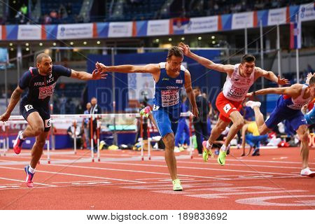 BELGRADE SERBIA - MARCH 3-5 2017: MAN 60M HURDLES TRAJKOVIC MILAN EUROPEAN ATHLETICS INDOOR CHAMPIONSHIPS IN BELGRADE SERBIA