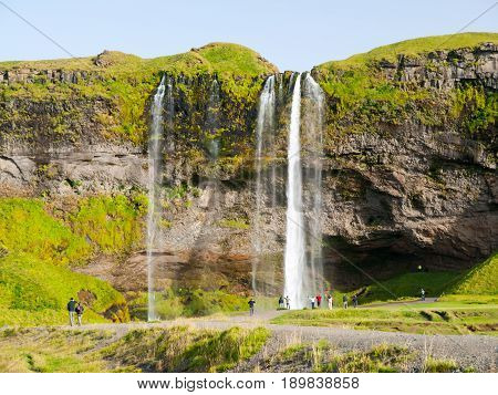 Seljaland Waterfall, aka Seljalandsfoss, front view on sunny day in Iceland