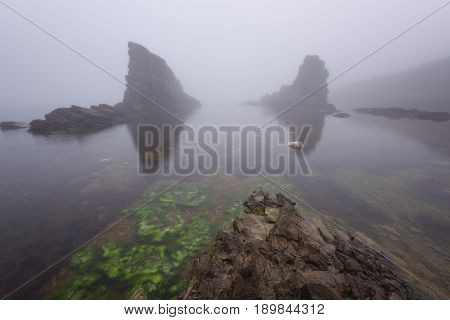 Magnificent seascape over the rock phenomenon The Ships, Sinemorets village, Bulgaria. Foggy weather.
