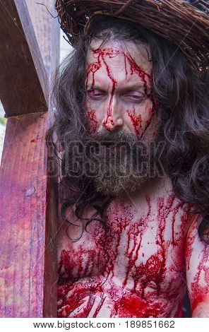 JERUSALEM - APRIL 14 : Christian pilgrim re-enact the crucifixtion of Jesus along the Via Dolorosa in Jerusalem during Good friday on April 14 2017