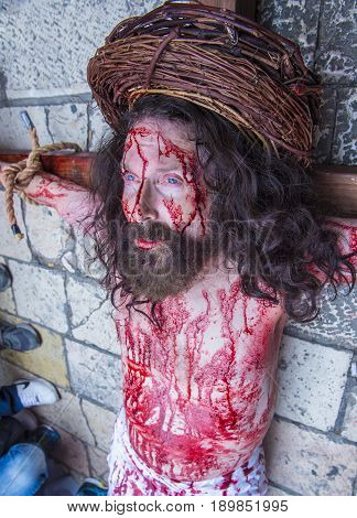 JERUSALEM - APRIL 14 : Christian pilgrim re-enact the crucifixtion of Jesus along the Via Dolorosa in Jerusalem during Good friday on April 14 2017