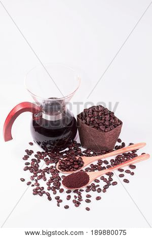 Coffee beans for drip coffee and black coffee in the glass jar on white background.