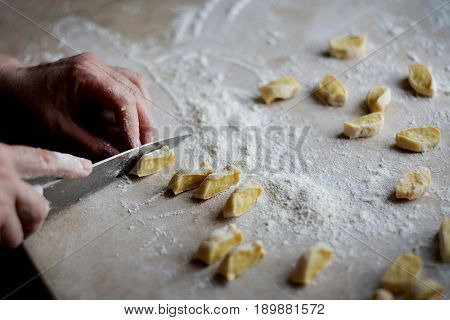 Process of making dumplings, raw ravioli in flour in details