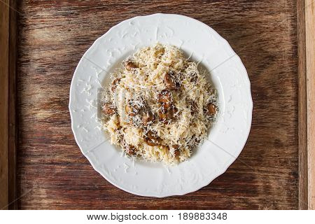 Mushroom Risotto With Parmesan Cheese. Italian Food. Simple Back