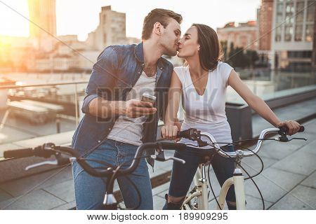 Romantic Couple With Bicycles In The City