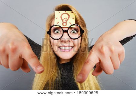 Woman Having Light Bulb Mark On Forehead Thinking