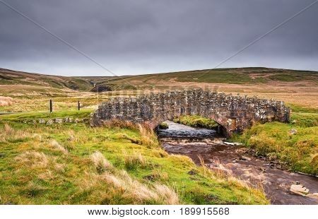 Stonesdale Bridge - Stonesdale Beck flows below Stonesdale Bridge on Stonesdale Moor in Upper Swaledale part of Yorkshire Dales National Park