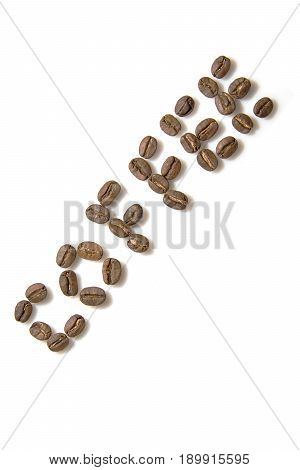 Inscription from coffee beans on the white background