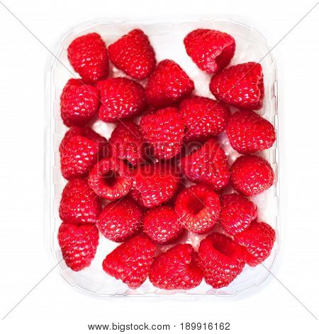 Ripe raspberries isolated on white background in a plastic box close up macro