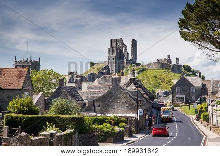 CORFE CASTLE, UK - 1st JUNE, 2017: Village of Corfe and ruins of Corfe Castle, in Swanage, Dorset, Southern England 