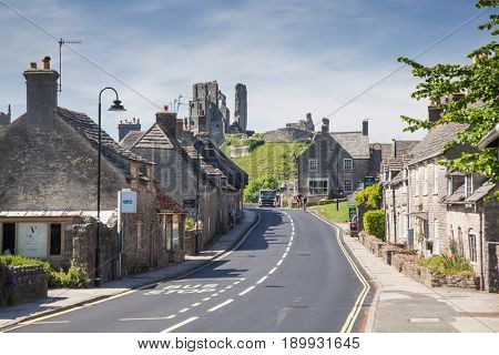 CORFE CASTLE, UK - 1st JUNE, 2017: Village of Corfe and ruins of Corfe Castle, in Swanage, Dorset, Southern England 