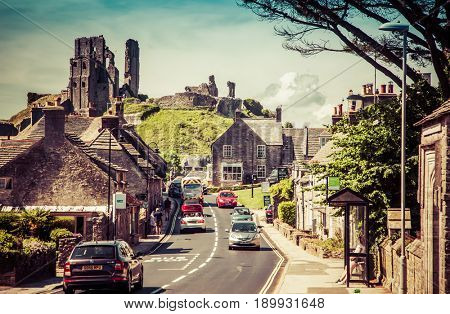 CORFE CASTLE, UK - 1st JUNE, 2017: Village of Corfe and ruins of Corfe Castle, in Swanage, Dorset, Southern England 