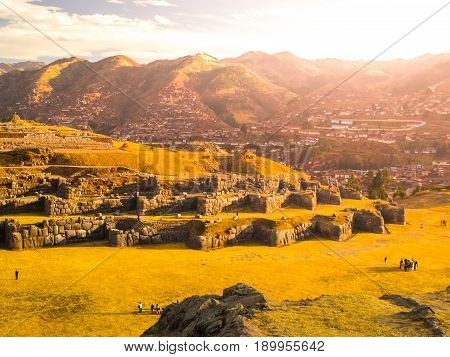 Fort Sacsayhuaman and Cuzco city on backgroudn on sunny day, Peru.