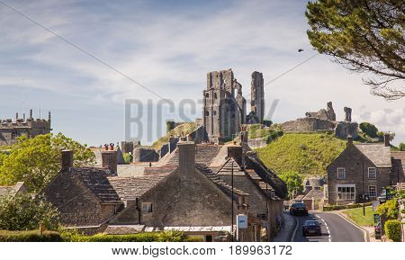 CORFE CASTLE, UK - 1st JUNE, 2017: Village of Corfe and ruins of Corfe Castle, in Swanage, Dorset, Southern England 