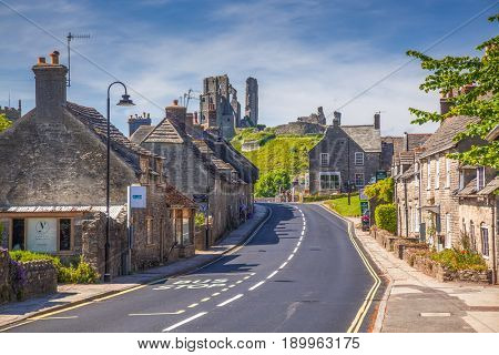 CORFE CASTLE, UK - 1st JUNE, 2017: Village of Corfe and ruins of Corfe Castle, in Swanage, Dorset, Southern England 