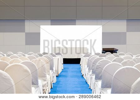 Empty Meeting Room With Stage, Table, Isolated On White Background, Podium And Chairs For Business C