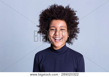 Dark-haired African American Little Person Being Extremely Happy During Photoshoot