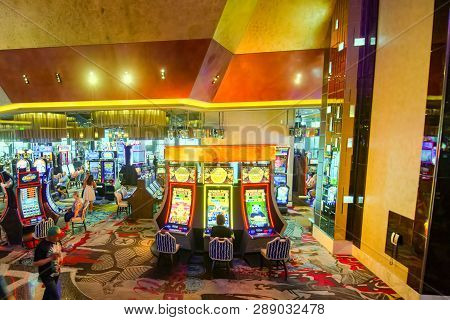 Interior Of The Casino Is Inside- Game Tables, Slot Machines, Roulette.